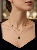 Double layered locket with green stones
