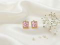 Anti tarnish baby pink golden square studd earrings